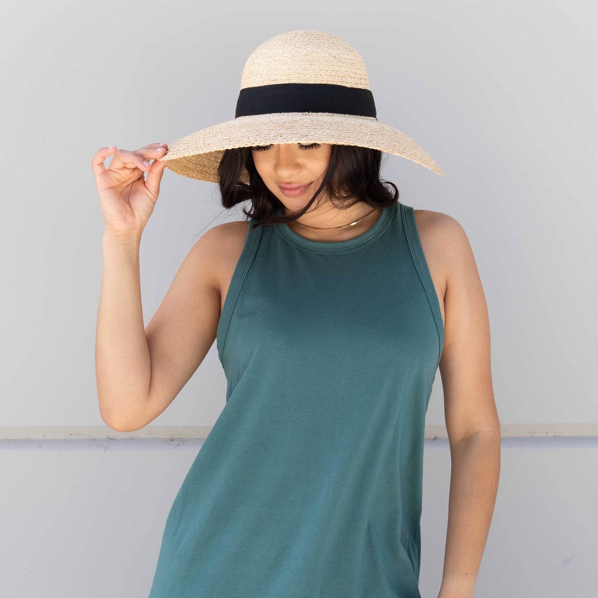 Women's Large Brim Raffia Hat With A Black Ribbon 3 Women's Large Brim Raffia Hat With A Black Ribbon