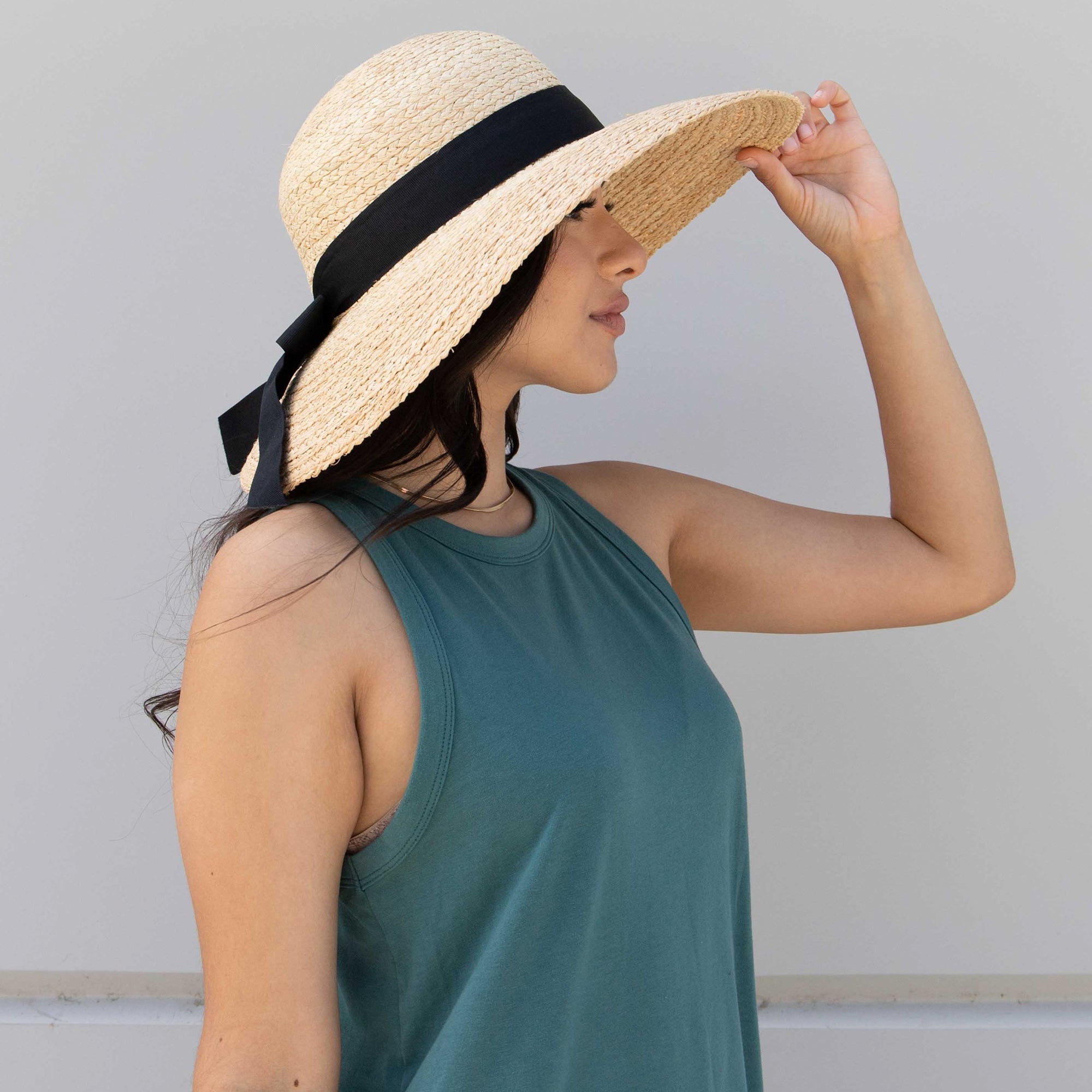 Women's Large Brim Raffia Hat With A Black Ribbon 4 Women's Large Brim Raffia Hat With A Black Ribbon